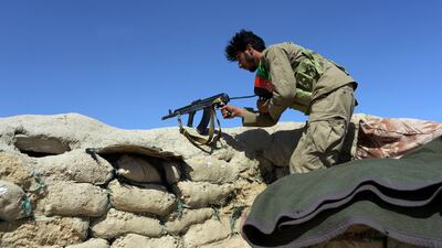 Afghan security forces keep watch near the site of a US airstrike on a civilian vehicle in Haska Mina district, Nangarhar province, on August 12, 2017. Noorullah Shirzada / AFP
