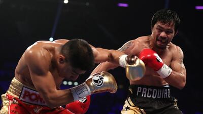 Manny Pacquiao, right, and Jessie Vargas trade punches. Christian Petersen / Getty Images