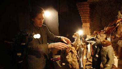 The director Wes Anderson with some of his Fantastic Mr Fox characters.