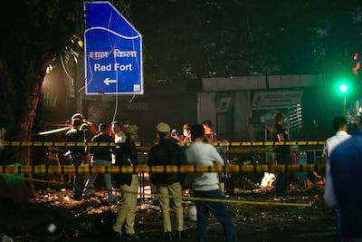Security personnel inspect the blast site in New Delhi. AP