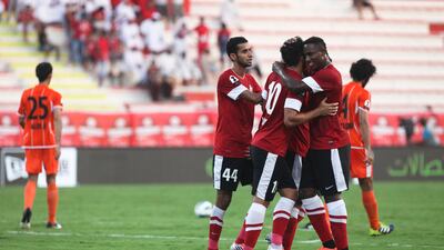 Dubai, UAE, October 14, 2012: Dubai and Ajman faced off tonight in the Etisalat Cup. Ajaman , in the end, was victorious, 2-1, after a very sloppy first half. Al Ahli players surround Luis to congratulate him after he scored his team's only goal. Lee Hoagland/The National