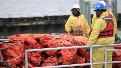 More than 750 people are working to resolve the oil spill. Houston Chronicle / Karen Warren / AP Photo