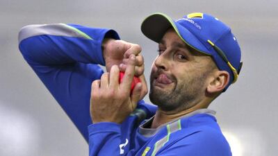 Australia’s Nathan Lyon bowls during a net session at the Adelaide Oval ahead of their day-night cricket Test against New Zealand. Rick Rycroft / AP Photo