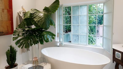 A standalone bathtub offers lovely views of the courtyard. Courtesy Ammar Basheir