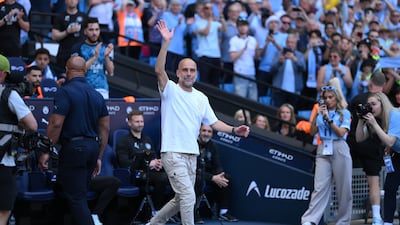 Manchester City manager Pep Guardiola waves to supporters ahead of the match against Aston Villa at the Etihad Stadium. EPA
