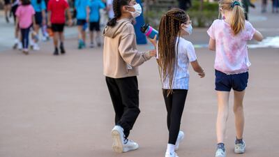 In Abu Dhabi schools, close contacts who show Covid symptoms can return only once they are symptom free - even if their PCR test is negative