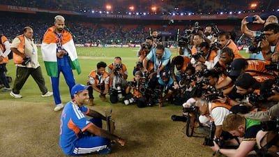 India captain Suryakumar Yadav poses for a photo with the trophy. Getty Images