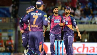 Rising Pune Supergiants bowler Ashok Dinda, centre, celebrates with teammates after dismissing Delhi Daredevils batsman Shreyas Iyer. Sajjad Hussain / AFP