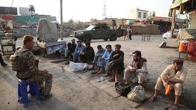 People, who fled a prison after a militant attack, sit on the ground after they were captured by Afghan security officials in Jalalabad, Afghanistan. EPA