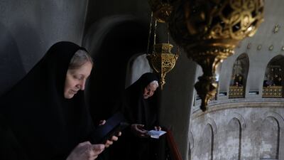 Orthodox Christian worshippers gather at the rooftop above the Tomb of Christ at the Church of the Holy Sepulchre in Jerusalem. EPA