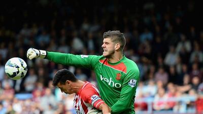 Carlton Cole of West Ham battles with Fraser Forster and Jose Fonte of Southampton during Southampton's 3-1 Premier League win on Saturday. Jamie McDonald / Getty Images
