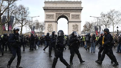 French police stand gaurd as demonstrators take part in the demonstration of the yellow vests at the Arc de Triomphe. Getty Images