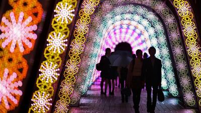 Visitors walk through Christmas illuminations in Tokyo. Many shopping malls, leisure facilities and streets start competing illuminations attracting people for Christmas and New Year selling season in Japan. Kimimasa Mayama / EPA