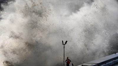 People have been urged to stay away from the coast, with concerns of high waves as seen in Mumbai. AP