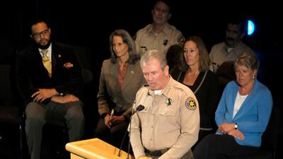 Ventura County Sheriff Geoff Dean, front, speaks during a candlelight vigil. AP Photo