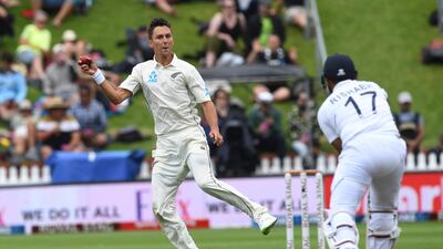 New Zealand's Trent Boult fields off his own bowling against India's Rishabh Pant. AP