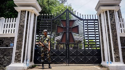 A Sri Lankan security officer guards St Sebastian’s Church in Negombo, Sri Lanka, April 23, 2019. Jack Moore / The National.