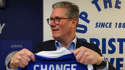 Labour leader Keir Starmer holds a Bristol Rovers football shirt. Getty Images