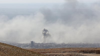 Smoke billows in the town of Douma, the last opposition holdout in Syria's Eastern Ghouta, on April 7, 2018, after Syrian regime troops resumed a military blitz to pressure rebels to withdraw. AFP