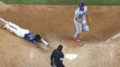 Randy Arozarena of the Tampa Bay Rays slides into home plate to score the game-winning run and give his team the 8-7 victory against the Los Angeles Dodgers in Game 4 of the MLB World Series at Globe Life Field in Arlington, Texas on Saturday, October 24. AFP