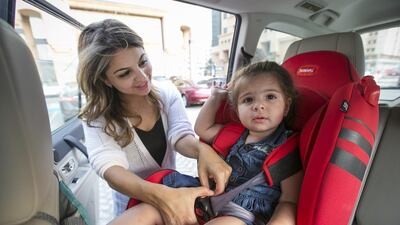 Lozan Gebbawi always straps her daughter Yara, 21 months, into a child seat when they travel by car. Mona Al Marzooqi / The National