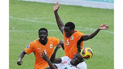 Kolo Toure, left, pictured for the Ivory Coast against Burkina Faso on September 5, has chosen not to fast on match days during his seven years in English football.