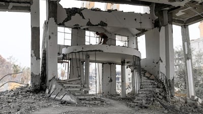 A member of the six-person team from the Roj Mine Control Organisation -- a non-governmental organisation working in Kurdish-held areas -- uses a handheld detector to look for explosives in the heavily-damaged Armenian Catholic Church of the Martyrs in the city centre of the eastern Syrian city of Raqa. Two historic churches in Syria's Raqa will be declared free of explosives soon but the devastation in the city has left no one to celebrate in them. AFP