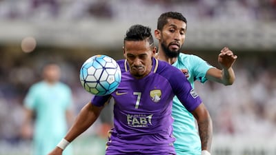 Al Ain winger Caio, front, shields the ball from Al Hilal's Salman Alfaraj during the Asian Champions League first leg quarter-final in the UAE that finished 0-0. Chris Whiteoak / The National