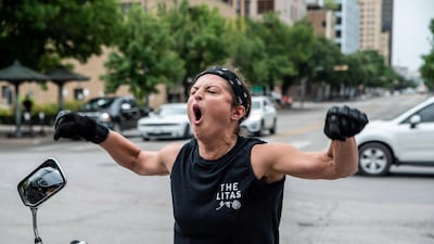 A Black Lives Matter protester reacts towards people protesting against mandates to wear masks amid the pandemic in Austin, Texas this week. Reuters