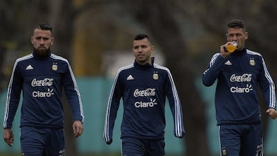 Argentina's Sergio Aguero, centre, with Nicolas Otamendi, left, and Martin Demichelis, all of Manchester City, shown at training on Monday before the team play Ecuador on Thursday in 2018 World Cup qualifying. Juan Mabromata / AFP