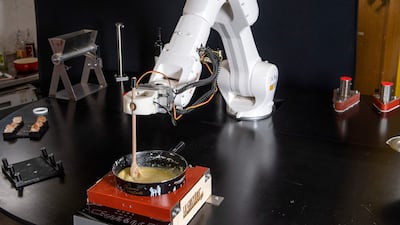 A robot cooking Swiss fondue. AFP