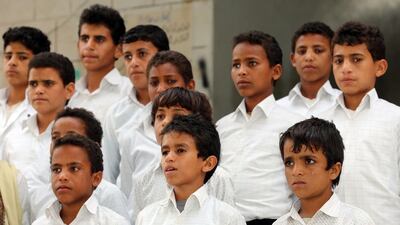 Yemeni children, former Houthi fighters, are pictured outside a rehabilitation centre at a school in the town of Marib, on January 29, 2018. AFP