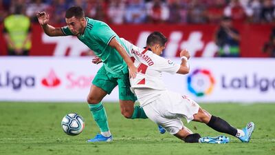 Eden Hazard duels for the ball with Javier Hernandez. Getty Images
