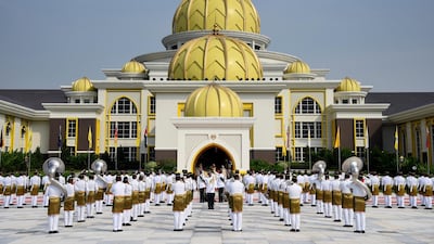 Malaysian honour guards saluting during an event to mark the coronation of Malaysia's new king. EPA