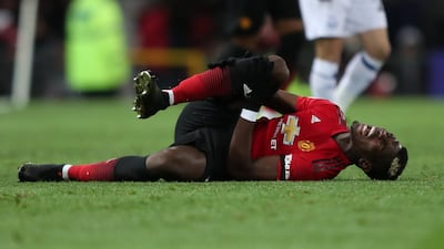 Pogba reacts after sustaining an injury. Action Images via Reuters