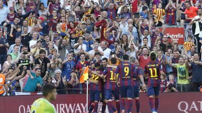 Barcelona's Pedro Rodriguez celebrates his opening goal with teammates on Saturday in their 2-0 La Liga win over Real Sociedad. Gustau Nacarino / Reuters / May 9, 2015