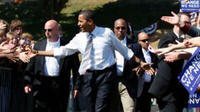 U.S. Democratic presidential nominee Senator Barack Obama (D-IL) greets supporters during a campaign rally in Asheville, North Carolina, October 5, 2008.
