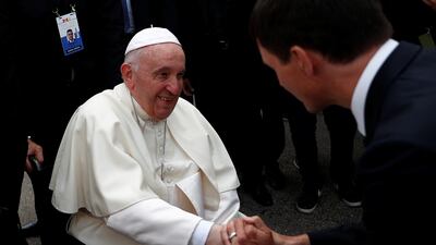Pope Francis is welcomed by Canada's Prime Minister Justin Trudeau after arriving at Edmonton International Airport on Sunday. Reuters