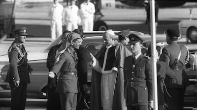 King Hussein welcomes Pope Paul VI, right, on the tarmac of Amman's airport on January 6, 1964. AFP