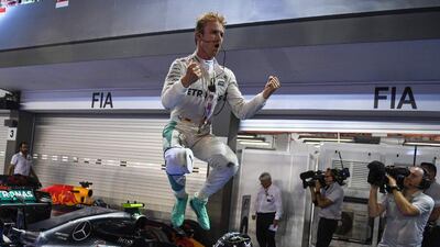 Mercedes driver Nico Rosberg jumps from his car as he celebrates winning the Singapore Grand Prix on Sunday. Mohd Rasfan / AFP / September 18, 2016