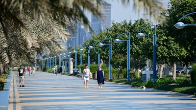 Taking a stroll along the Corniche in Abu Dhabi. Khushnum Bhandari / The National