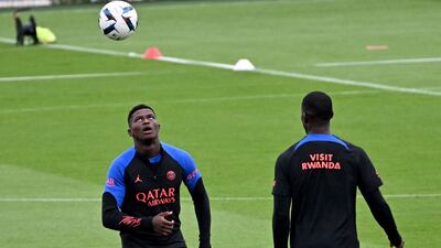 PSG defender Nuno Mendes takes part in a training session. AFP