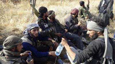 Syrian rebels gather in Al Jarba to the east of Damascus, where they have been attempting to break a blockade by forces loyal to Bashar Al Assad. Some rebels near the Turkish border say they have no problem with Al Qaeda “as Al Qaeda is helping us, while foreign countries are not”. Msallam Abd Albaset / Reuters