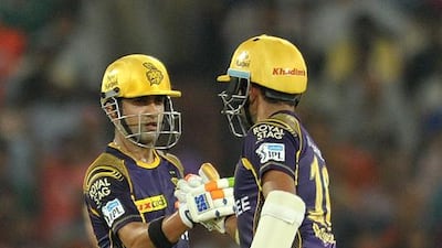Kolkata Knight Riders cricketer Gautam Gambhir, left, celebrates with teammate Robin Uthappa. Noah Seelam / AFP