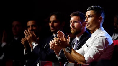Cristiano Ronaldo of Juventus and Messi react during the Uefa Champions League draw. Getty Images