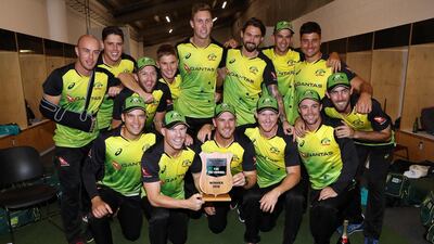 Australia's cricket players celebrate after winning the final Twenty20 Tri-Series against New Zealand at Eden Park in Auckland. Michael Bradley / AFP