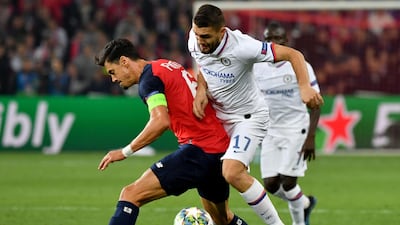 Lille's Jose Fonte, left, vies with Chelsea's Mateo Kovacic. AFP