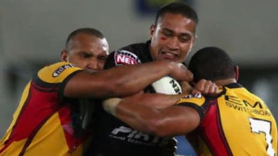 Setemata Sa of the New Zealand takes on the PNG defence.