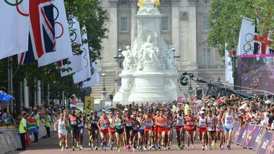 Athletes run on the Mall during the athletics event men's marathon. Olivier Morin/AFP Photos