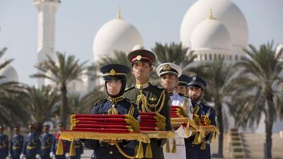 Members of the Armed Forces hold Martyrs’ Medals during the first Commemoration Day ceremony, honouring those who lost their lives in the performance of their duty. Ryan Carter / Crown Prince Court – Abu Dhabi